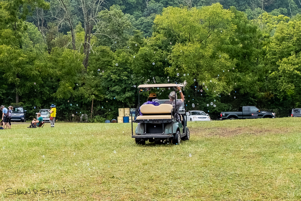 Bubbles being blown from a golf cart during the 61st annual Philadelphia Folk Festival (Shaun R. Smith/ The High Note).