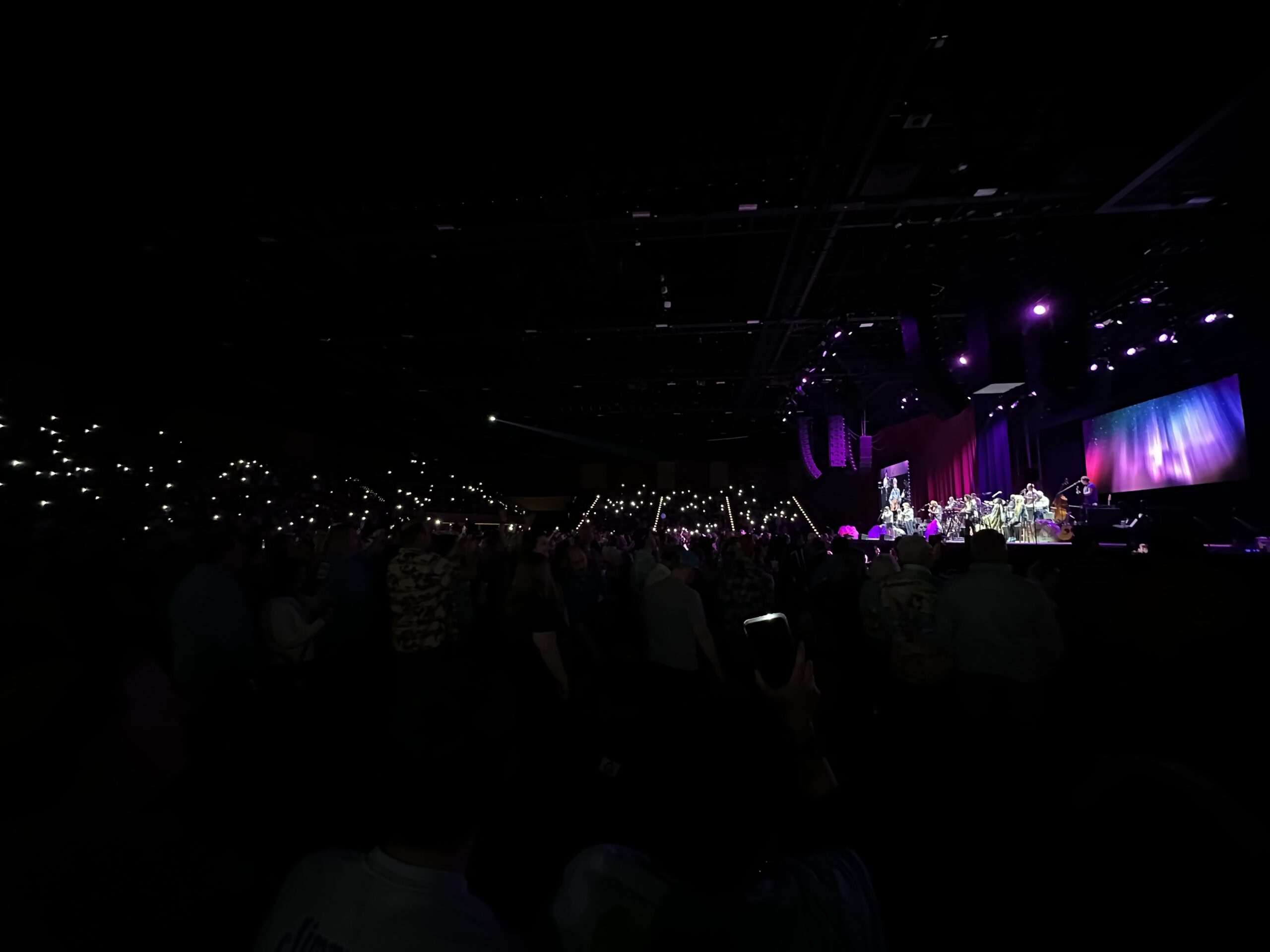 The crows uses their flashlights to pay tribute to Jimmy Buffett during a Coral Reefer Band concert Jan. 24, 20254 at Hard Rock Live in Atlantic City, New Jersey. 