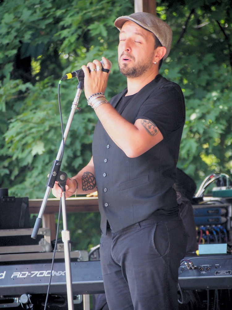 Andres Martorell of Baile An Salsa sings during the Celtic Workshop on the Camp Stage at the 56th annual Philadelphia Folk Festival (The High Note/ Shaun R. Smith).