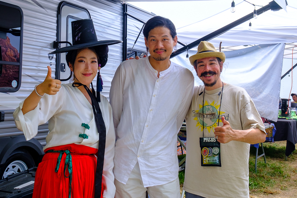 ADG7 singer Hong Ok, and bandleader Kim Yak Dae with Shaun Smith at the 60th annual Philadelphia Folk Festival.