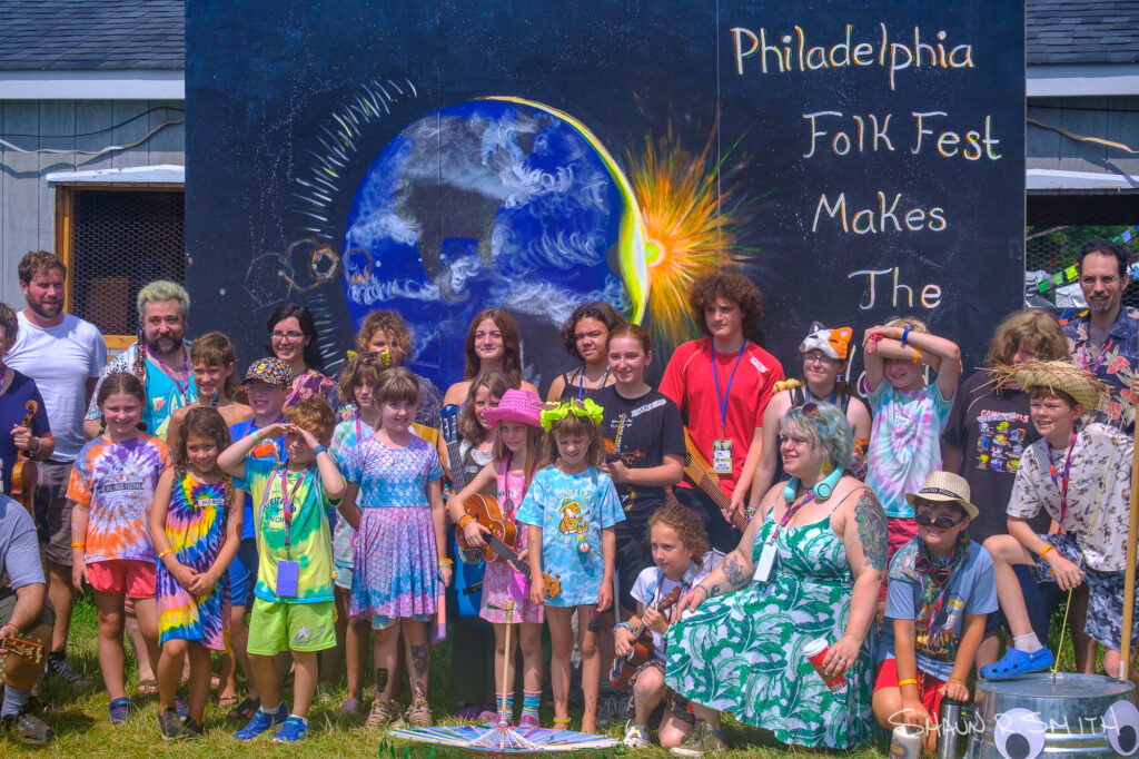 Members of the Great Groove Band pose for a photo before their Martin Guitar Main Stage performance at the 62nd annual Philadelphia Folk Festival Sunday, Aug. 17, 2025 (Shaun R. Smith/ The High Note).